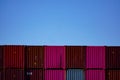 Colorful stack of steel cargo containers awaiting transport Royalty Free Stock Photo